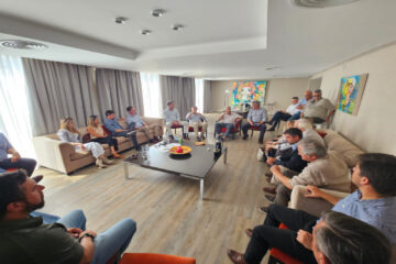 Frigerio con el hermano de su ex rival